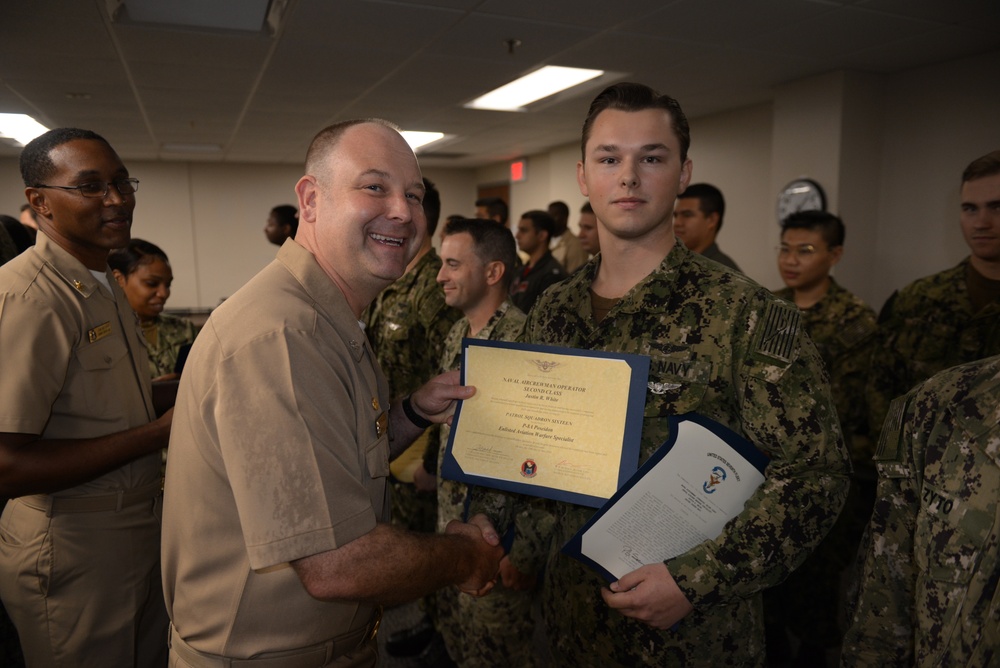 Awards Quarters for deserving Sailors