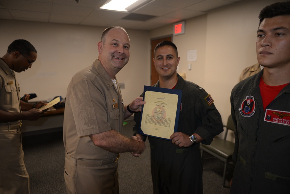 Awards Quarters for deserving Sailors