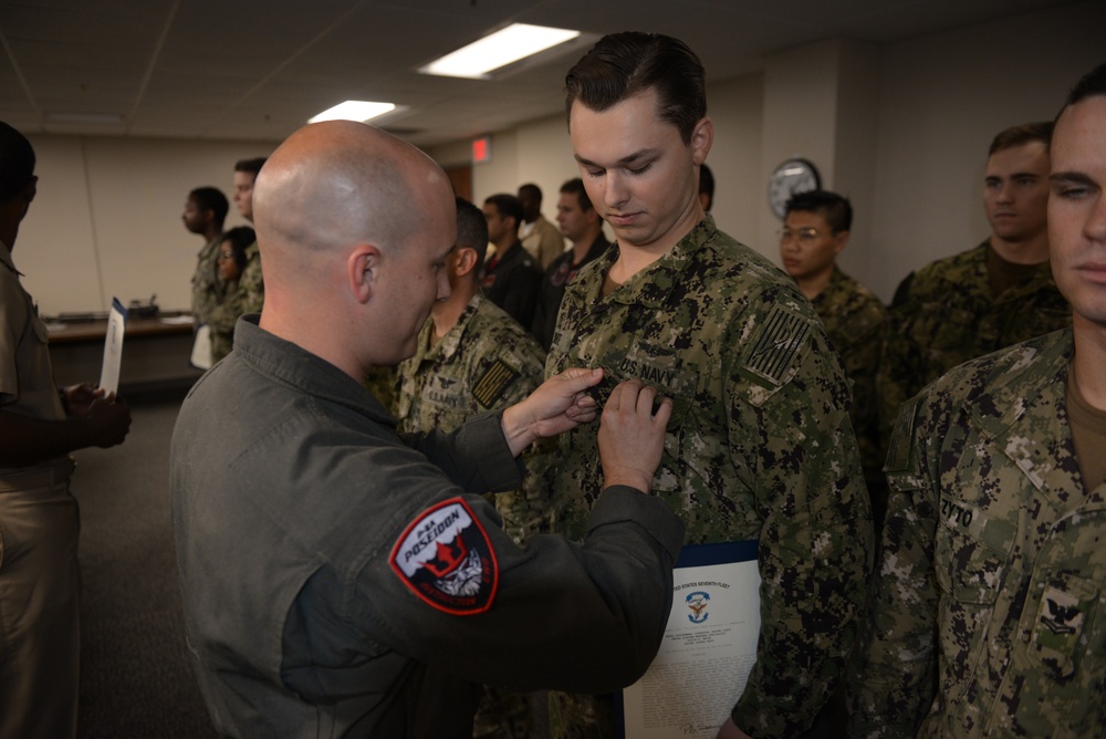 Awards Quarters for deserving Sailors