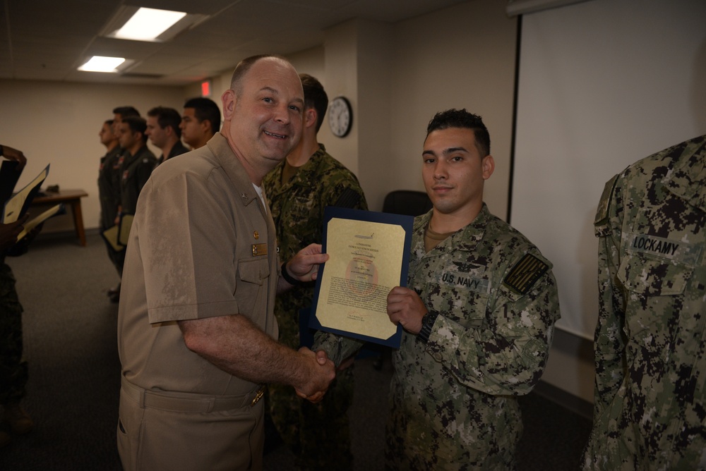 Awards Quarters for deserving Sailors