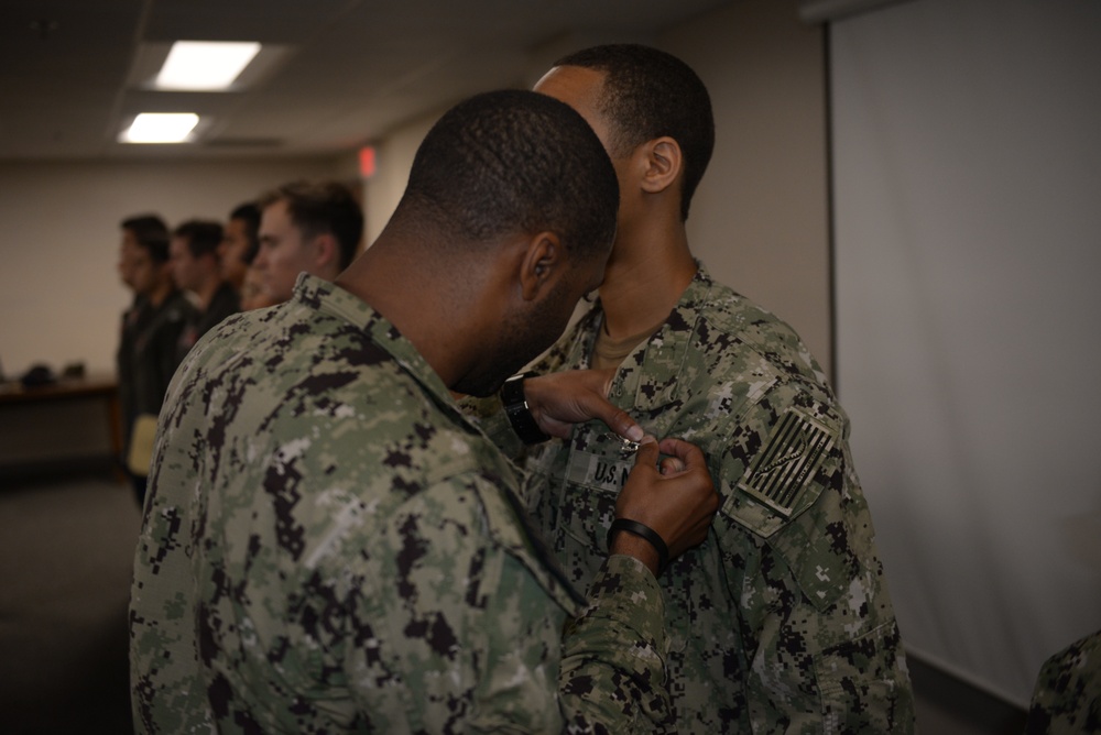 Awards Quarters for deserving Sailors