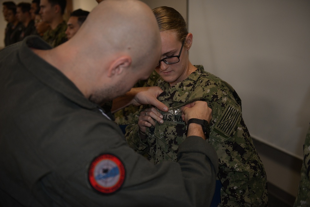 Awards Quarters for deserving Sailors