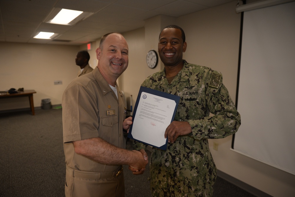 Awards Quarters for deserving Sailors