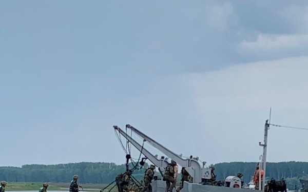 Soldiers board ferry during Saber Guardian 19