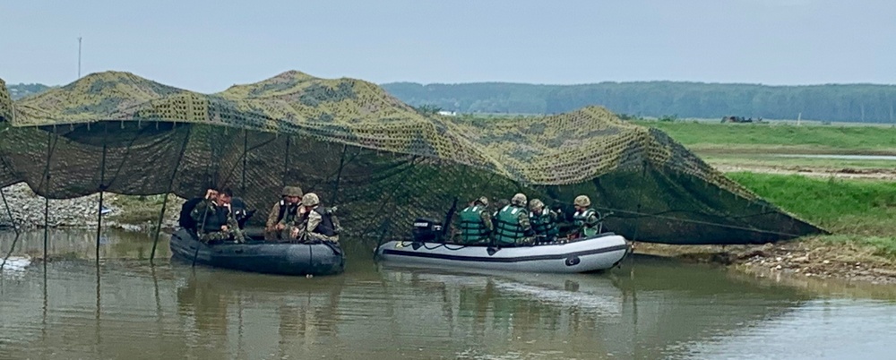 Romanian Soldiers wait to cross the Danube River