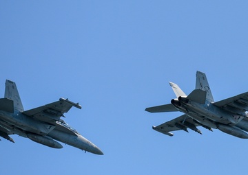 E/A-18 Growlers Fly Overhead Nimitz