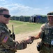 Col. Case, Commander of the 209th DLD receives gift from Romanian coalition partner at Saber Guardian
