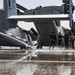 Aviation Boatswain's Mate (Handling) 2nd Class sprays water on the flight deck