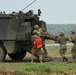 Polish soldiers load Romanian soldier into a combat ambulance during Saber Guardian 19