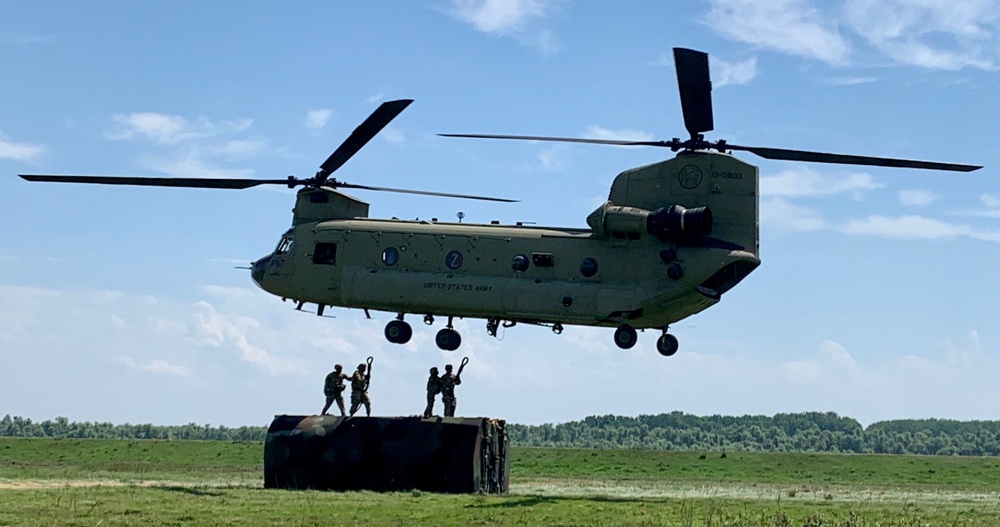 Soldiers attach raft section to Chinook
