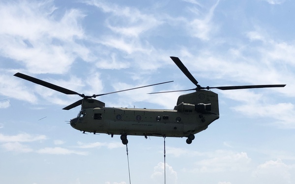 Chinooks conduct sling load operations