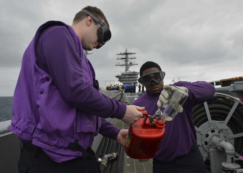 Nimitz Sailors Conduct Fuel Hose Maintenance