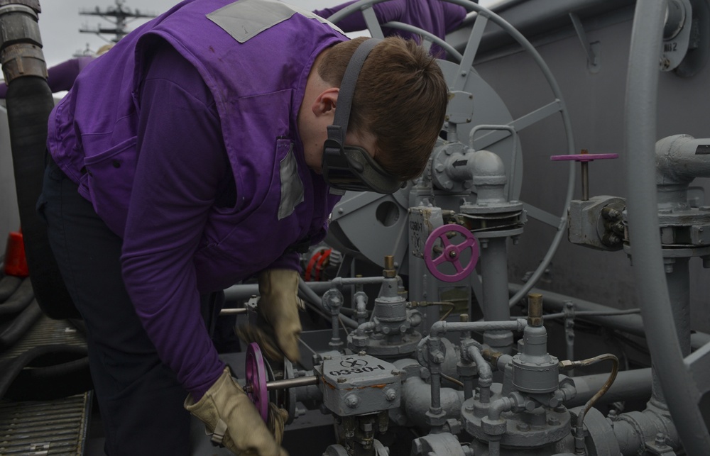 Nimitz Sailor Conducts Fuel Hose Maintenance