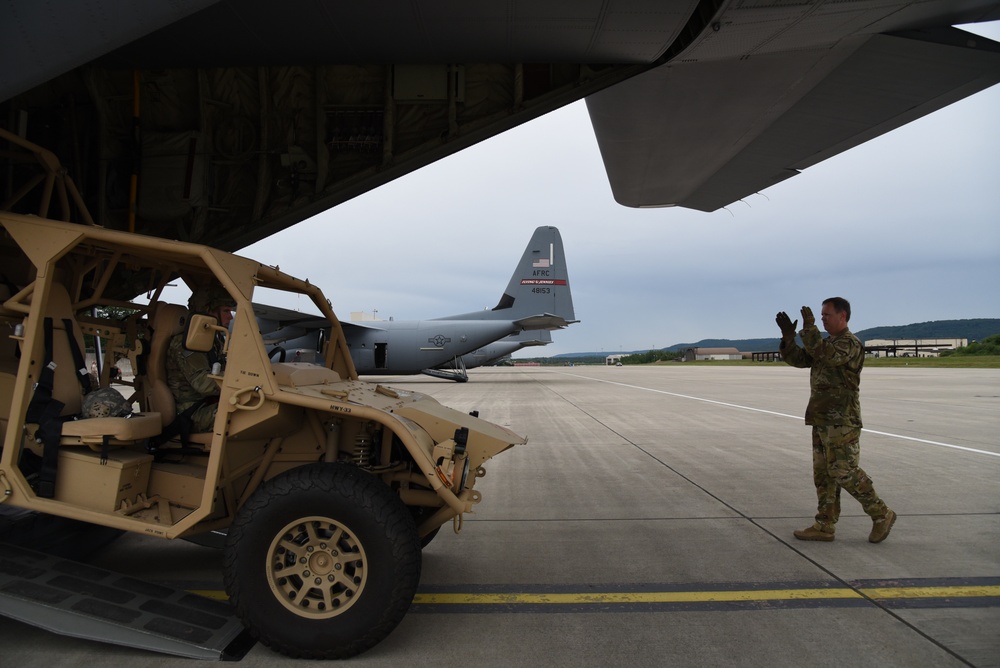 Army, Air Force Reserve work together loading C-130J