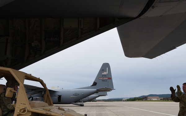 Army, Air Force Reserve work together loading C-130J
