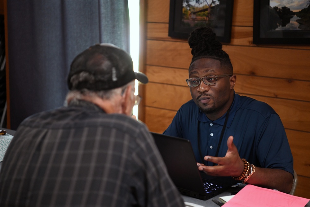 A FEMA Representative Speaks to a Local Resident at a Disaster Recovery Center