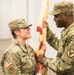 Maj. Christl Kroeten, the 275th Combat Sustainment Support Battalion (CSSB), Outgoing Battalion Commander,  gives the unit’s flag to the 518th Brigade Commander, Col. Gerry Jackson.