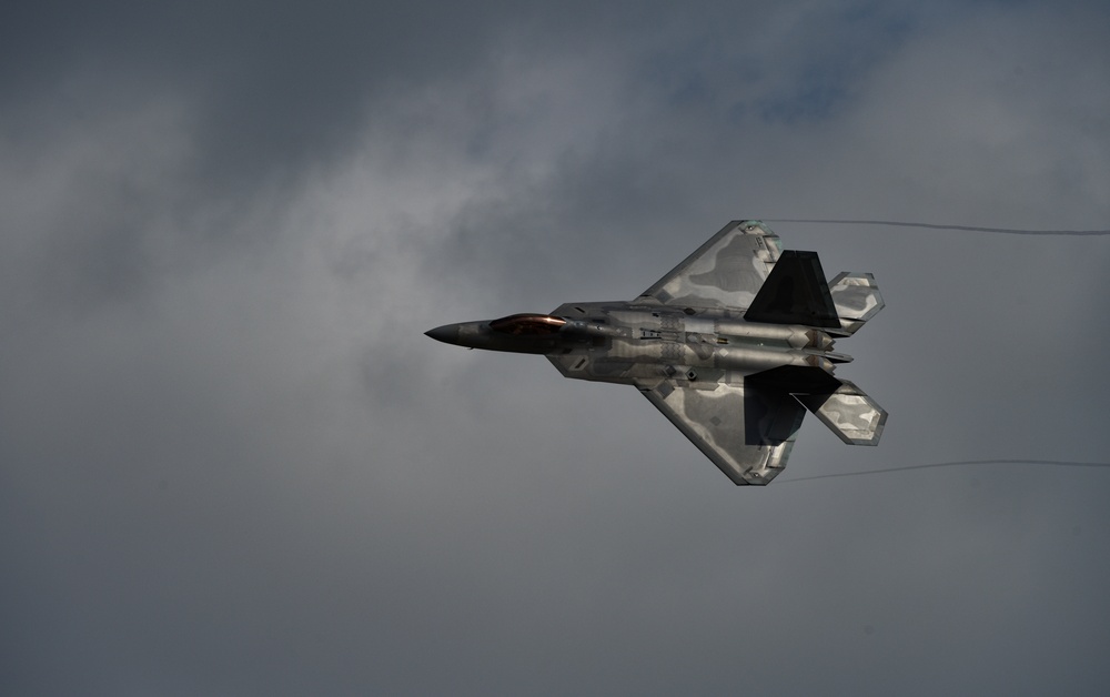 F-22 Raptor banks during air show maneuver