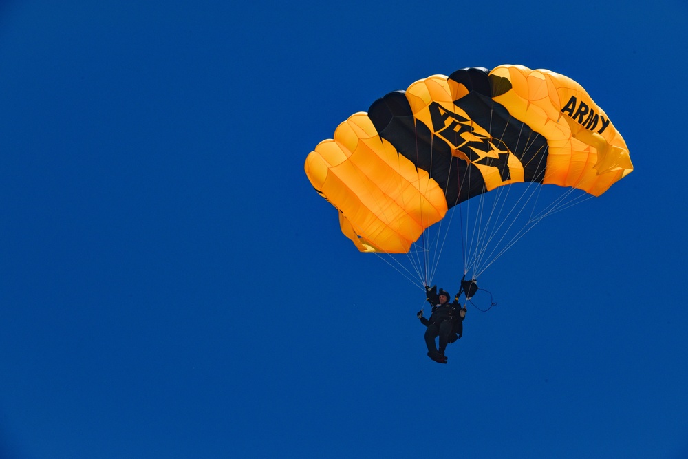 Elite U.S. Army parachutists demonstrate skills during Whiteman Air Force Base airshow