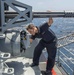 Nimitz Sailor Inspects CIWS Gun Mount