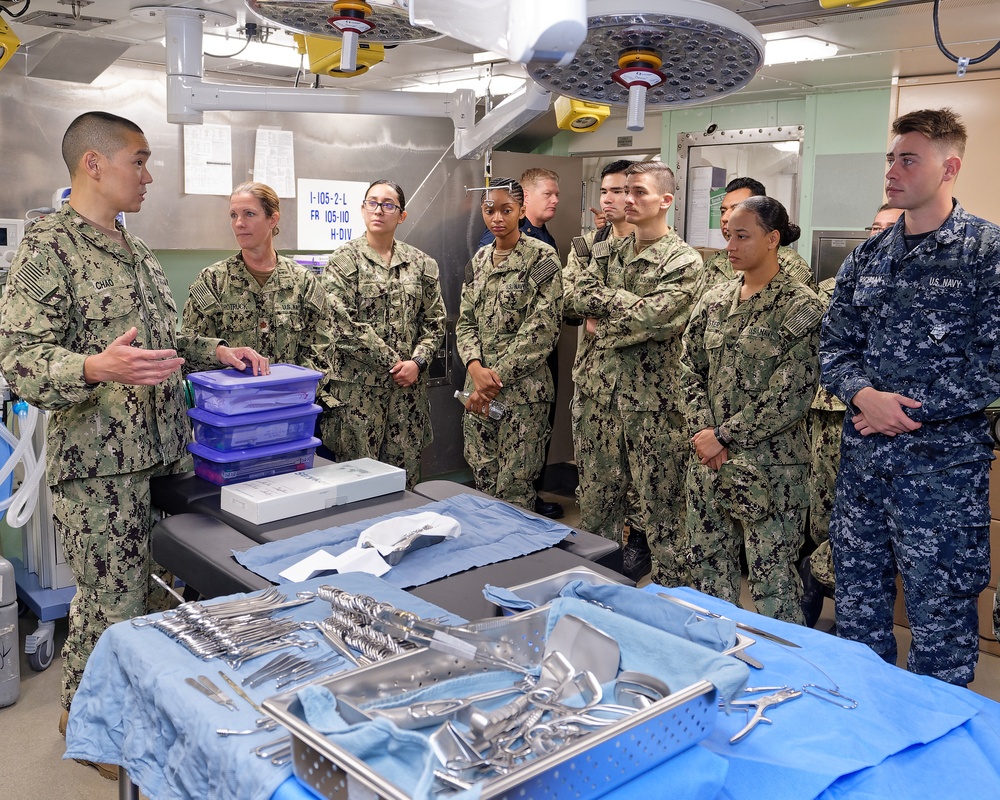 Sailors assigned to Fleet Surgical Team Three prepare for a mass casualty drill brief.
