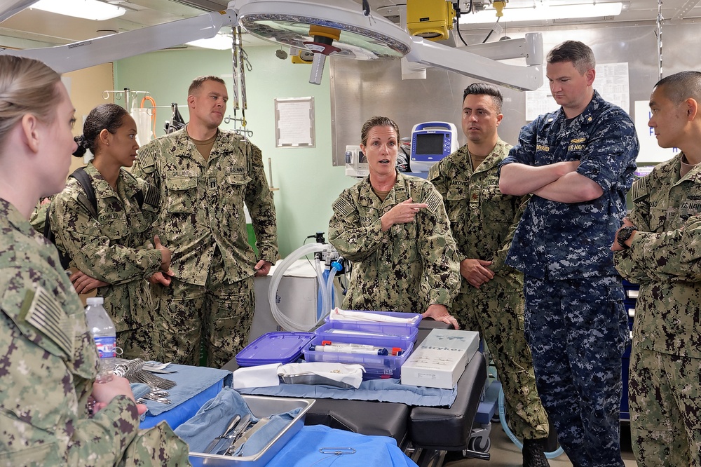 Sailors assigned to Fleet Surgical Team Three prepare for a mass casualty drill brief.
