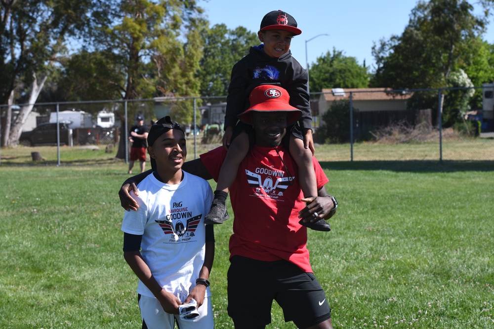 Travis youth play football with 49ers Pro athlete