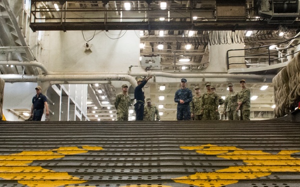 U.S. Sailors assigned to Fleet Surgical Team Three receive a pre-drill brief aboard USS New Orleans
