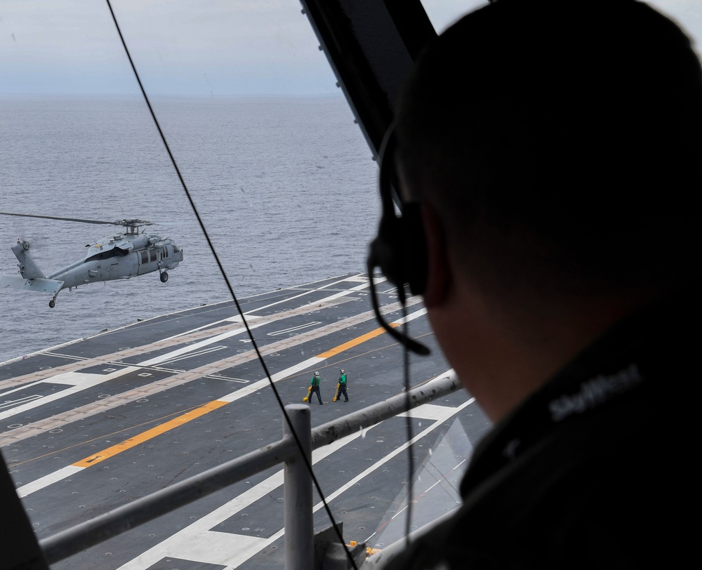 Nimitz Air Boss Conducts Helo Operations