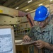 Sailor Takes Inventory of Packages