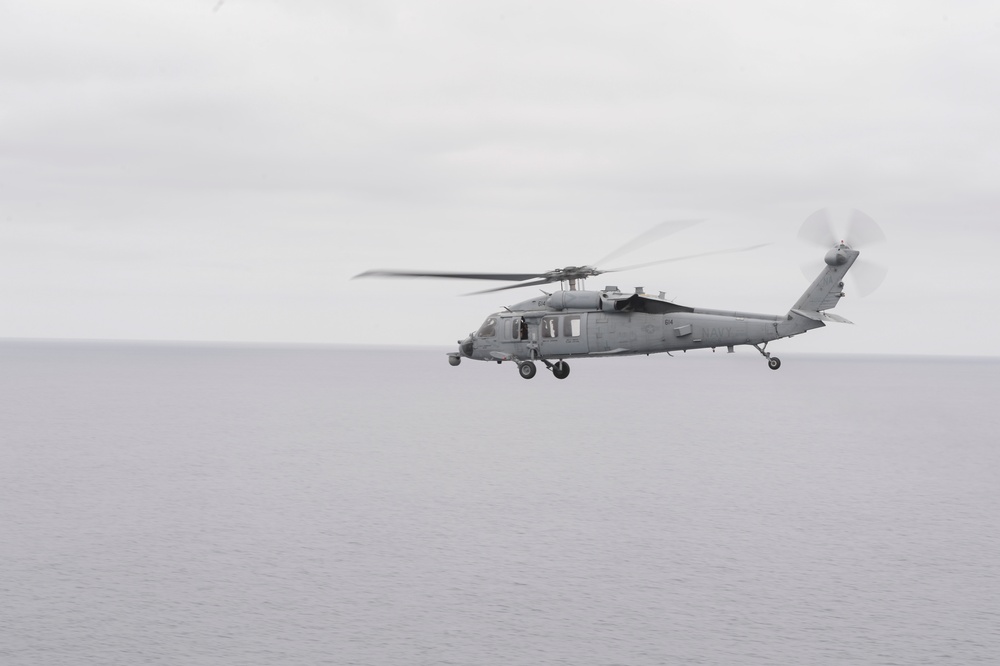 MH-60S Sea Hawk Helicopter Flies By Nimitz