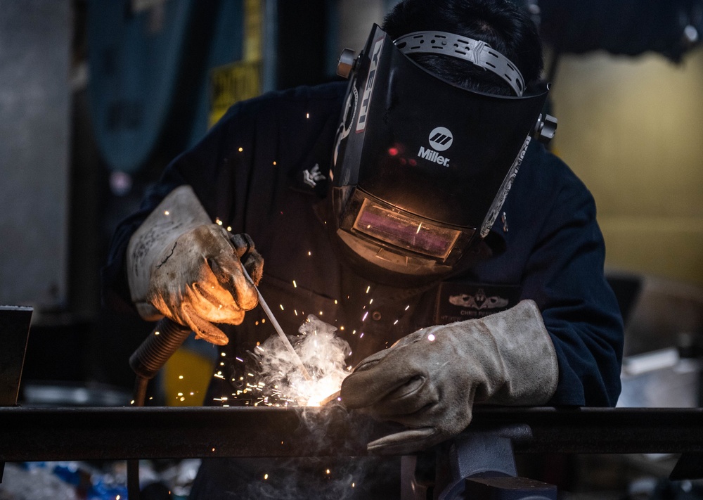 Sailor Welds Aboard USS Harpers Ferry