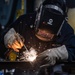 Sailor Welds Aboard USS Harpers Ferry