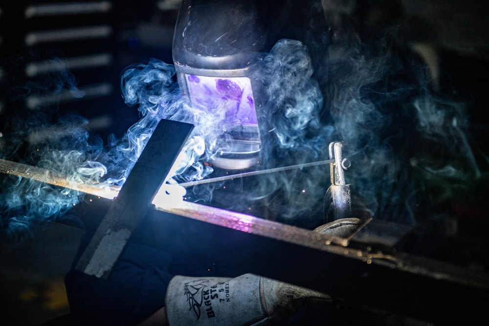 Sailor Welds Aboard USS Harpers Ferry