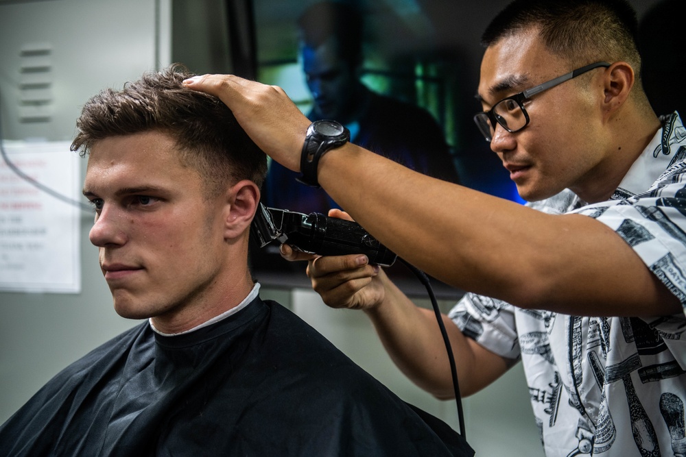 Marine Cuts Hair Aboard USS Harpers Ferry