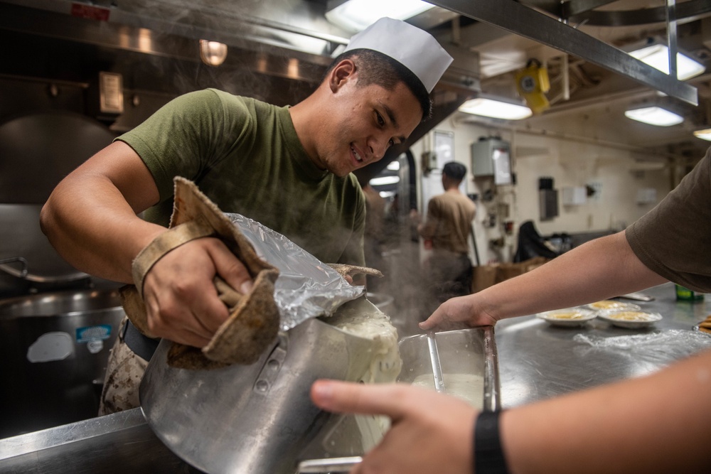 Sailor Cooks Aboard USS Harpers Ferry