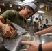 Sailor Cooks Aboard USS Harpers Ferry