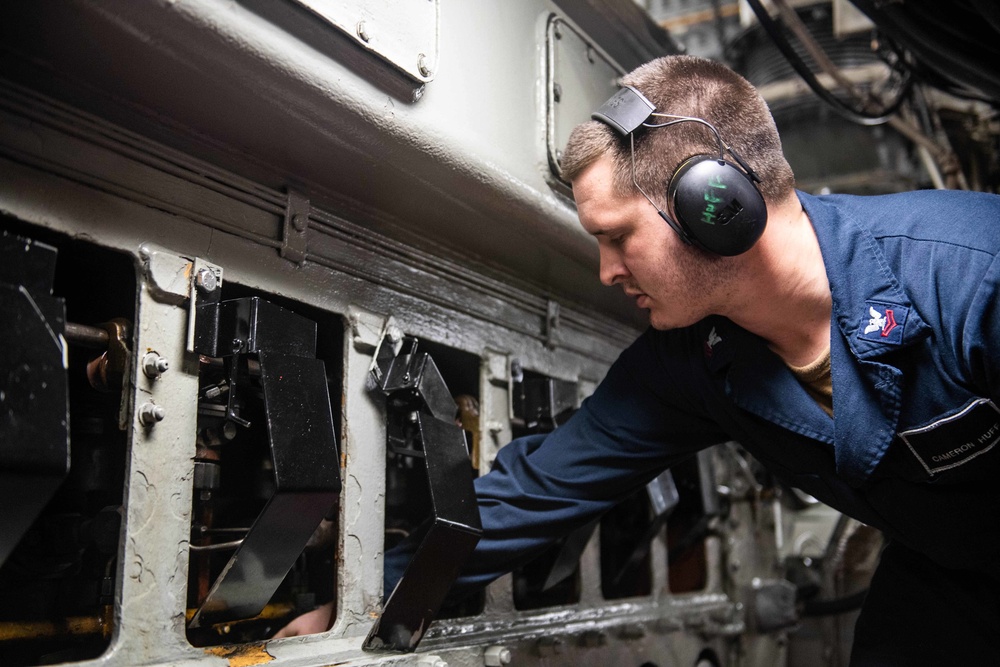 U.S. Navy Sailor Cleans Aboard USS Harpers Ferry
