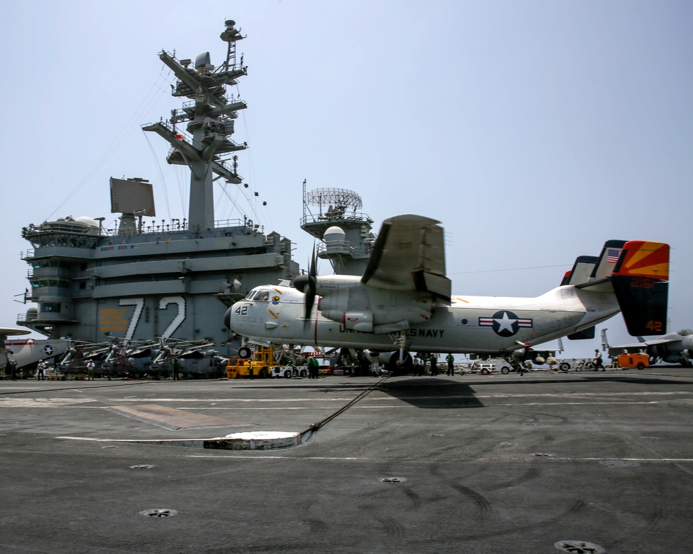 A C-2A Greyhound lands on the flight deck of the Nimitz-class aircraft carrier USS Abraham Lincoln (CVN 72)