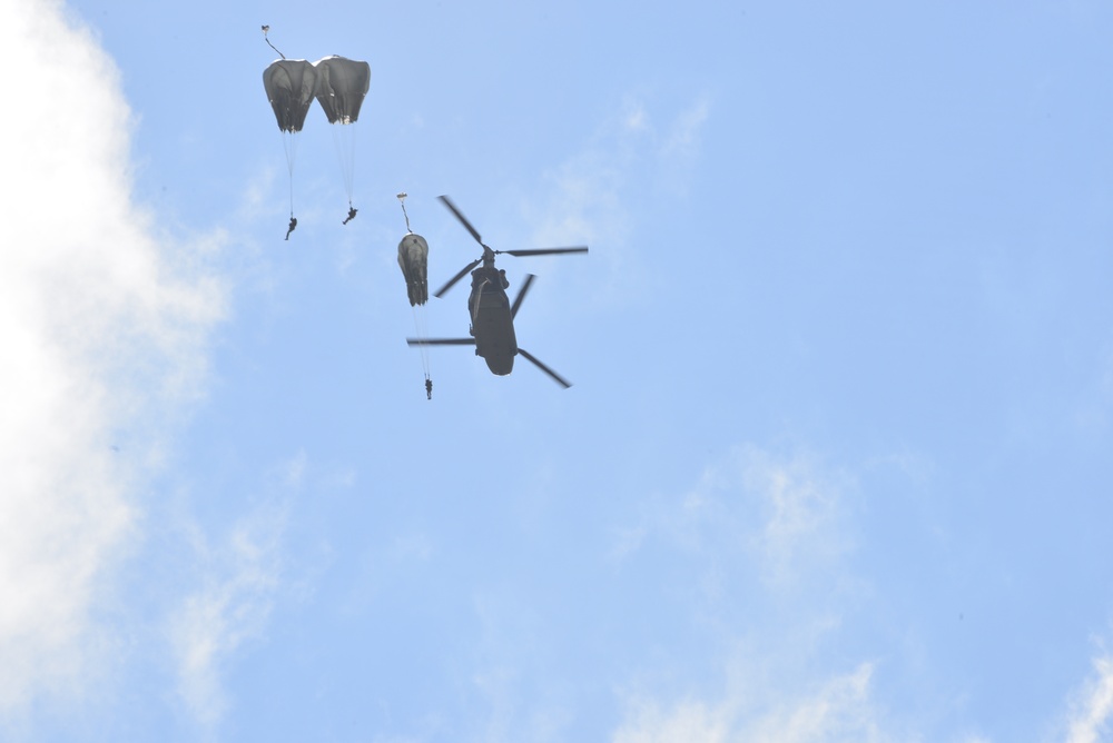 25th Infantry Division jump from a CH-47 Chinook helicopter during airborne training