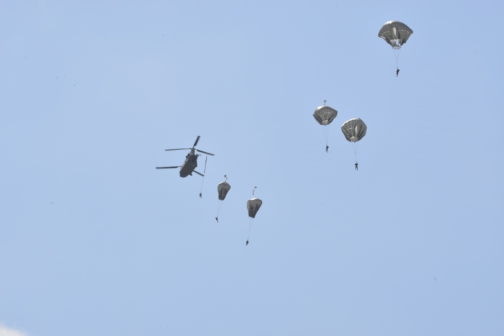 25th Infantry Division jump from a CH-47 Chinook helicopter during airborne training