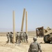 Army personnel building an observation platform in the Middle East