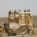 Army personnel build observation platform in the Middle East