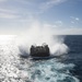 USS Wasp (LHD 1) and (NBU) 7 conduct Landing Craft, Air Cushion (LCAC) operations at sea