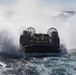 USS Wasp (LHD 1) and (NBU) 7 conduct Landing Craft, Air Cushion (LCAC) operations at sea