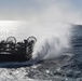 USS Wasp (LHD 1) and (NBU) 7 conduct Landing Craft, Air Cushion (LCAC) operations at sea