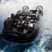 USS Wasp (LHD 1) and (NBU) 7 conduct Landing Craft, Air Cushion (LCAC) operations at sea