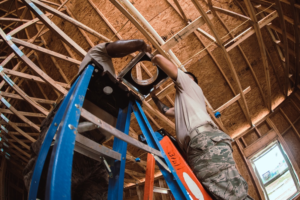 Airmen from the 137th Special Operations Wing Civil Engineering Squadron work to complete the contruction of Camp Kamassa in Crystal Spring, Mississippi