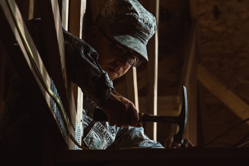 Airmen from the 137th Special Operations Wing Civil Engineering Squadron work to complete the contruction of Camp Kamassa in Crystal Spring, Mississippi