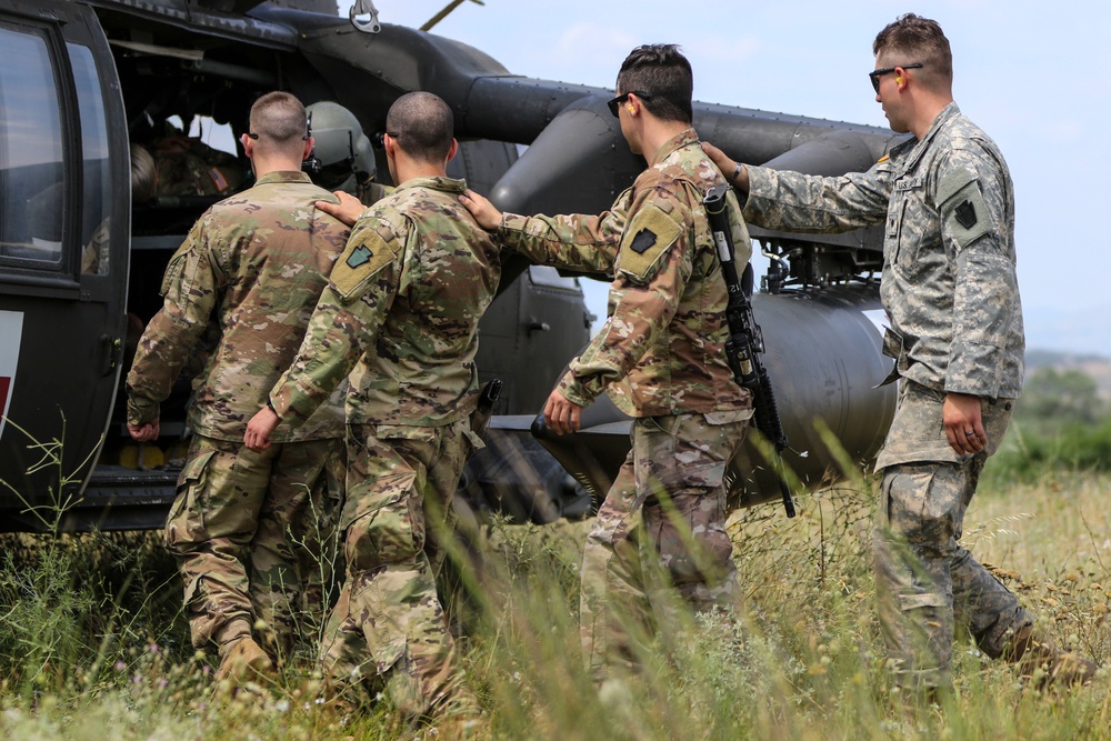 Medics of the 2-112th headquarters company practice cold and hot load training aboard Blackhawk
